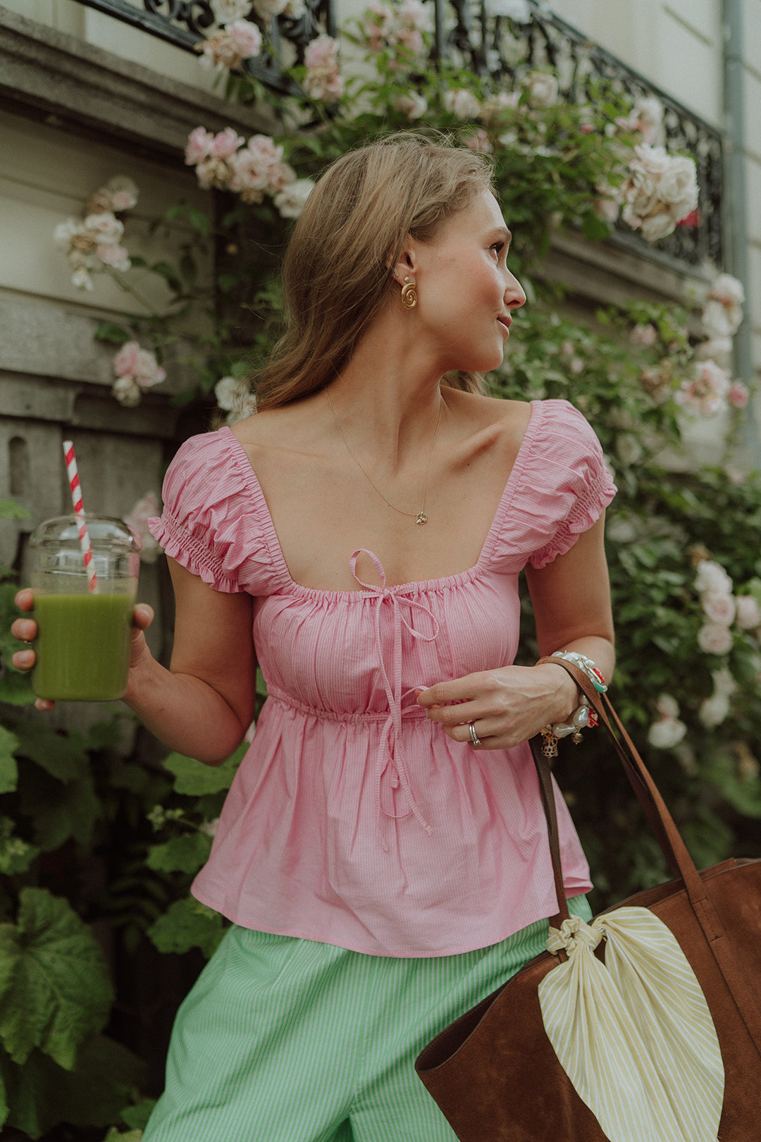 Woman wearing a cute pink and green set by Wolvie