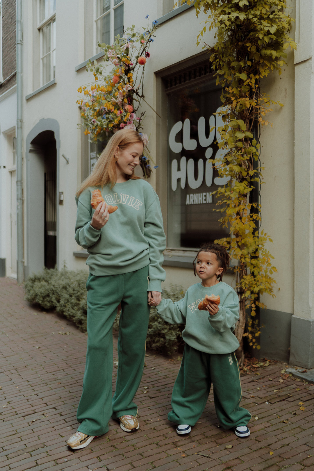Mom and child wearing matching green lounge sets