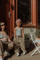 Matching mom and daughter outfit with grey tank tops and leopard print pants