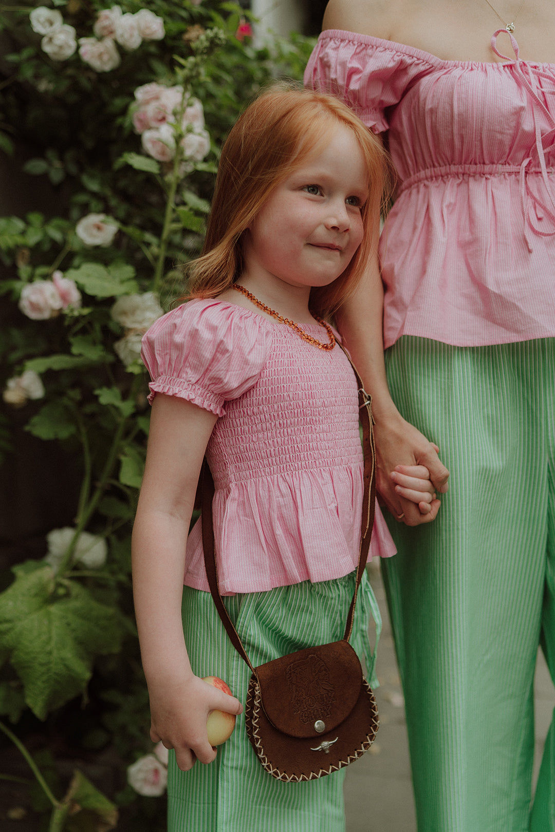 Mom and daughter wearing matching pink and green set by Wolvie