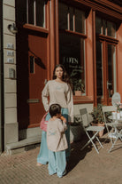 Matching mom and son outfit with striped shirts and light blue wide leg pants