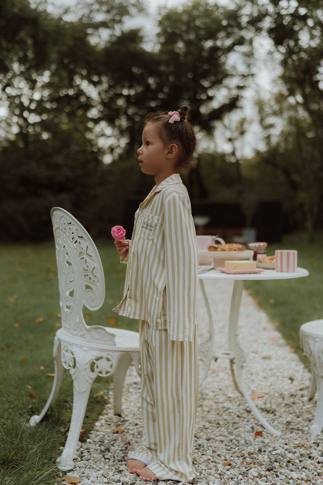 Little girl wearing a matching striped pyama set