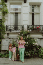 Woman and kids wearing matching set by Wolvie