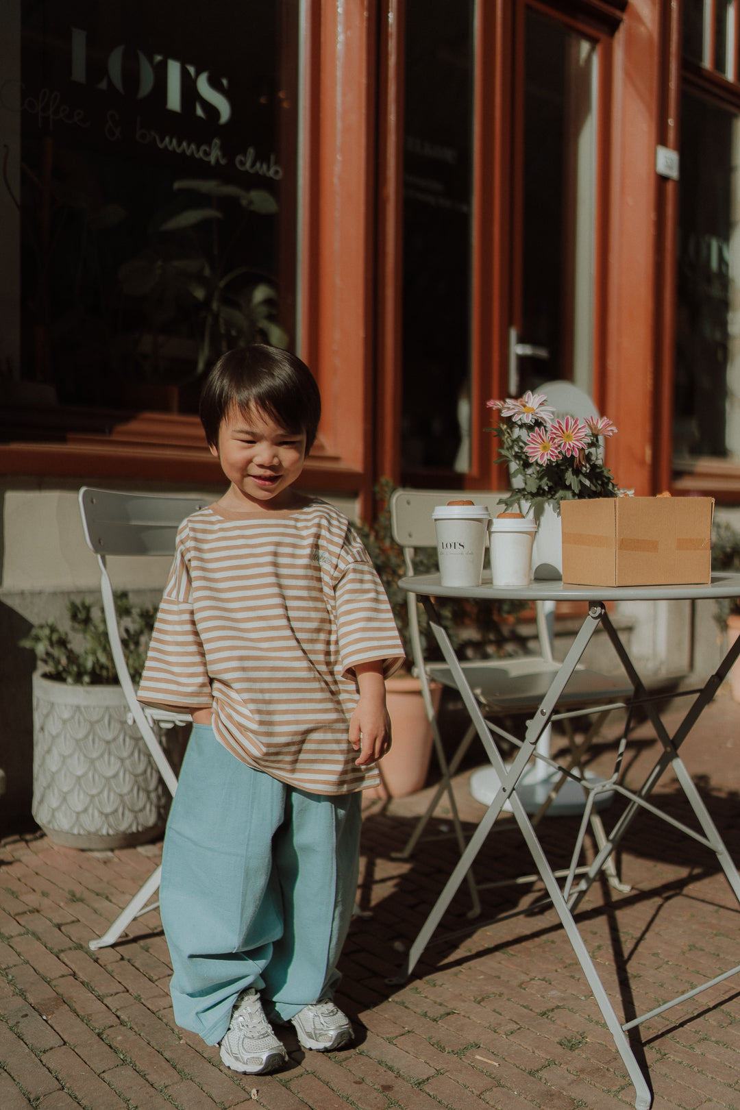 Comfortable kids outfit by WOLVIE featuring a soft striped shirt and relaxed blue pants for everyday wear
