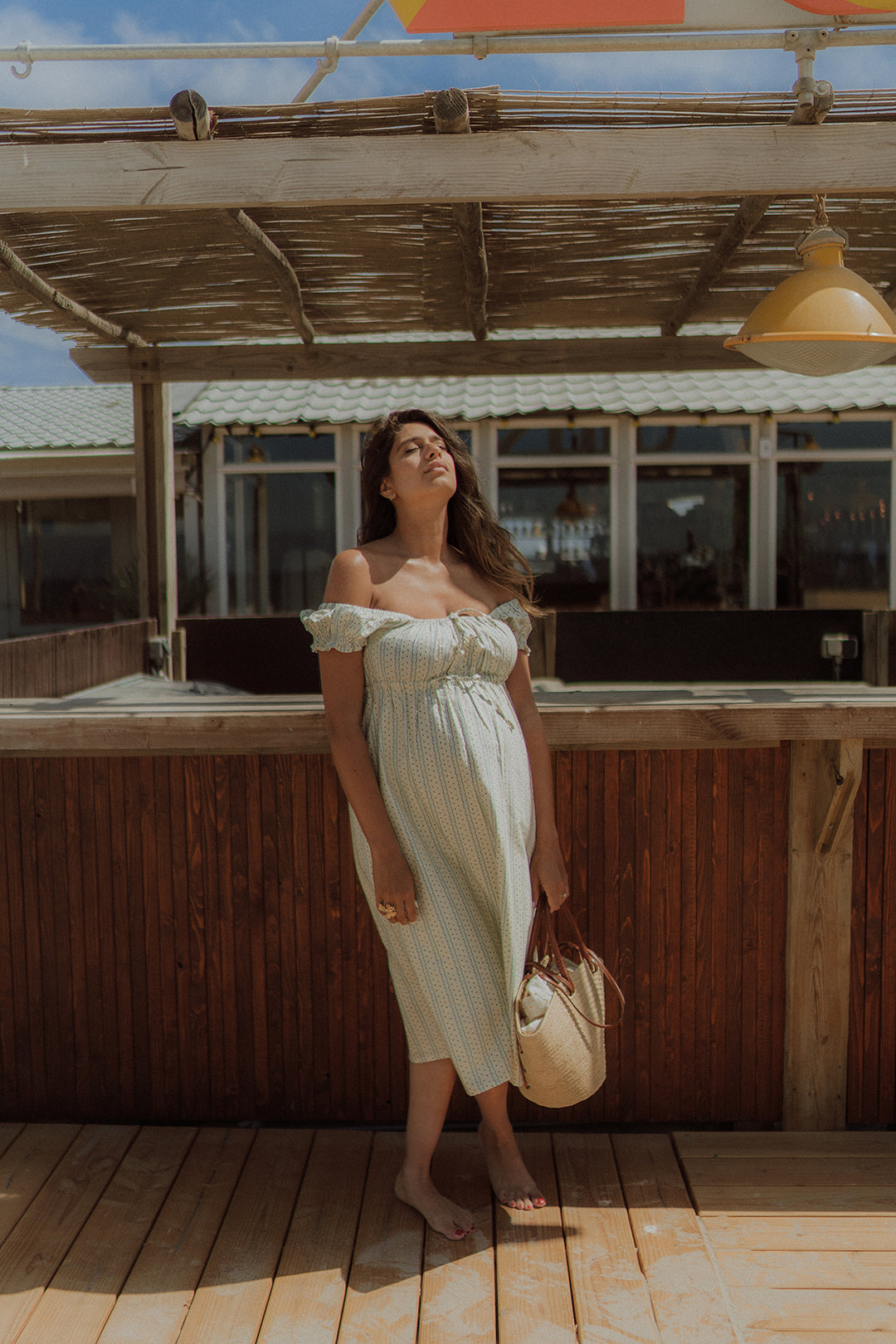 Woman wearing Freya summer dress by Wolvie
