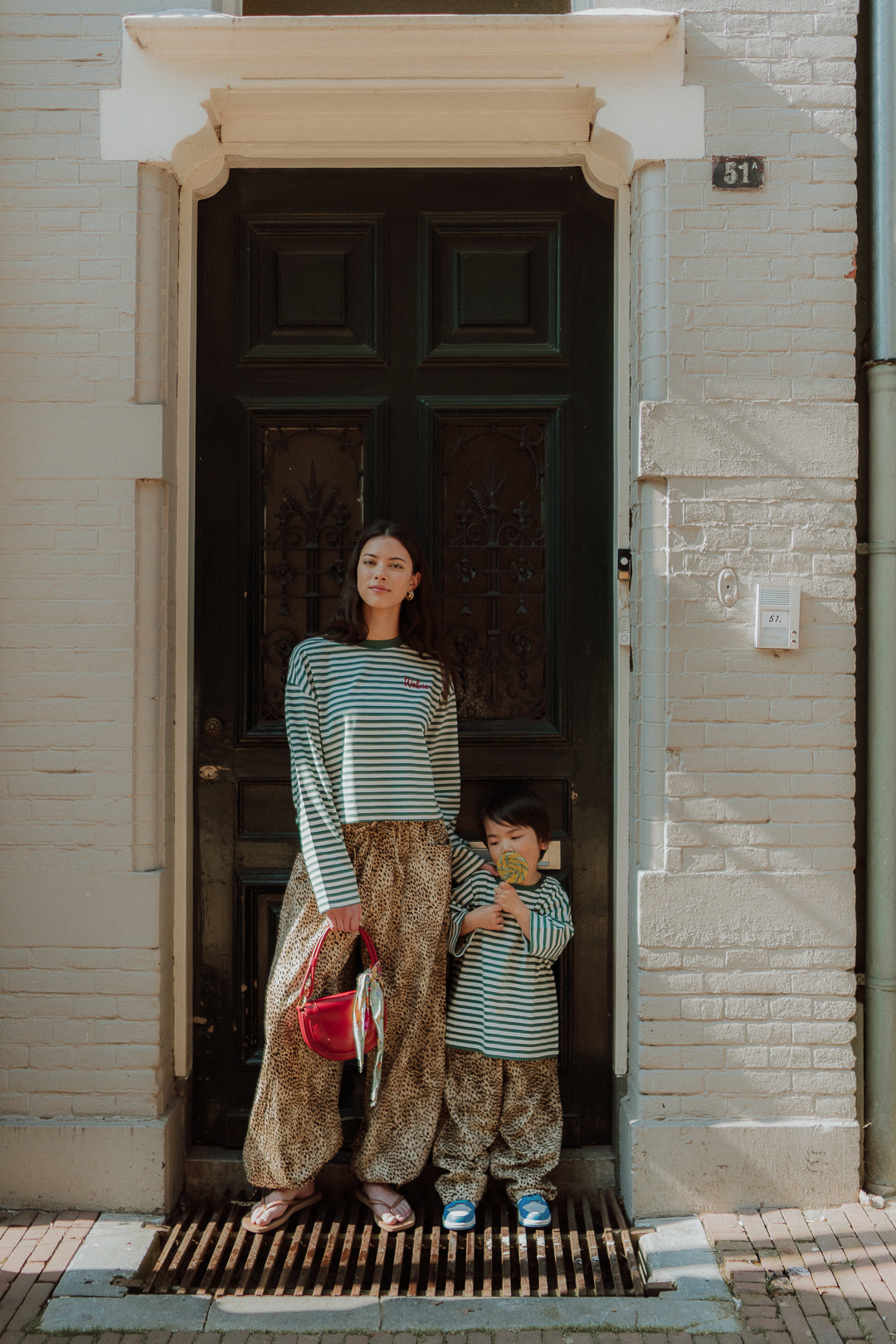Matching mom and son outfit with striped tops and leopard pants by Wolvie